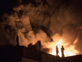 FILE - In this Sept. 2, 2018 file photo, flames engulf the 200-year-old National Museum of Brazil, in Rio de Janeiro. Federal police say an air conditioning unit is the "primary cause" of the fire that destroyed Brazil's National Museum in Rio de Janeiro. Fire experts have presented the conclusions of a seven-month investigation into the Sept. 2, 2018 fire, which began in the museum's auditorium and quickly spread to the rest of the building, destroying most of its 20 million artifacts.