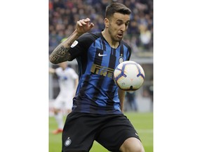 Inter Milan's Matias Vecino eyes the ball during an Italian Serie A soccer match between Inter Milan and Atalanta, at the San Siro stadium in Milan, Italy, Sunday, April 7, 2019.