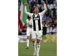 Juventus' Cristiano Ronaldo celebrates at the end of a Serie A soccer match between Juventus and AC Fiorentina, at the Allianz stadium in Turin, Italy, Saturday, April 20, 2019. Juventus clinched a record-extending eighth successive Serie A title, with five matches to spare, after it defeated Fiorentina 2-1.