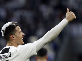 Juventus' Cristiano Ronaldo celebrates at the end of a Serie A soccer match between Juventus and AC Fiorentina, at the Allianz stadium in Turin, Italy, Saturday, April 20, 2019. Juventus clinched a record-extending eighth successive Serie A title, with five matches to spare, after it defeated Fiorentina 2-1.