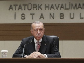 Turkey's President Recep Tayyip Erdogan talks to members of the media regarding the local elections, in Istanbul, Monday, April 8, 2019, prior to his departure for Russia. Erdogan has defended his ruling party's move to demand a full recount of votes cast in mayoral elections in Istanbul, claiming that "almost all" of the voting was marred by irregularities. Erdogan suffered a major setback in last week's local elections after the opposition took control of the capital Ankara and won a tight race for Istanbul. (Presidential Press Service via AP, Pool)