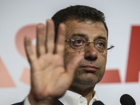 Ekrem Imamoglu, the candidate from an alliance led by the secular Republican People's Party, (CHP) gestures as he declares victory during a news conference in Istanbul, Monday April 1, 2019. Unofficial results by state-run Anadolu news agency said he had won 48.8 percent of the vote Sunday and his opponent, former Prime Minister Binali Yildirim of the ruling party, had captured 48.5 percent. One percent of the votes were still to be counted.