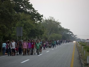 Central American migrants traveling in a caravan to the U.S. border walk on a road in Pijijiapan, Mexico, Monday, April 22, 2019. The outpouring of aid that once greeted Central American migrants as they trekked in caravans through southern Mexico has been drying up, so this group is hungrier, advancing slowly or not at all, and hounded by unhelpful local officials.