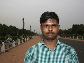 In this Tuesday, April 16, 2019, photo, engineering student Mayank Thakur, 18, stands for a photograph in New Delhi, India. With nearly half the electorate under 35 and more than 15 million first time voters, India's young can swing the national vote  in the world's largest democracy in any direction. "Unemployment is very high in India currently. India has a lot of engineers who haven't been able to develop their skills because there aren't enough jobs for them in India," Mayank told the Associated Press.