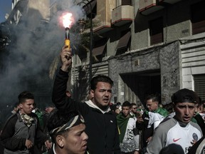 In this Friday, April 12, 2019 photo, young Algerians take part in a demonstration against the country's leadership in Algiers, Algeria. They're on the peaceful frontline of the protest movement that toppled Algeria's longtime ruler, facing down water cannons with attitude, memes _ and fearless calls for shampoo. Two-thirds of Algeria's population has no recollection of any leader other than former-President Abdelaziz Bouteflika, who has been driven out of the post he'd held since 1999 following nationwide protests since mid-February.