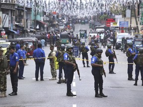 Sri Lankan Naval soldiers stand guard as authorities started clearing the debris from inside of the damaged St. Anthony's Church after it was targeted in a series of Islamic State-claimed suicide bombings that killed hundreds of people during Easter Sunday, in Colombo, Saturday, April 27, 2019. Sri Lankan security forces have found 15 bodies, including six children, after militants linked to the Easter bombings set off explosives during a raid on their house in the country's east.