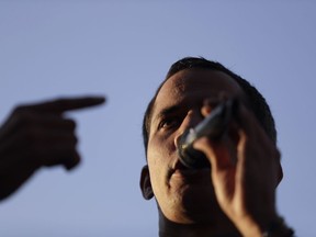 Venezuela's self-proclaimed interim president Juan Guaido speaks to supporters during a rally in Caracas, Venezuela.