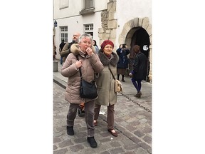 Cecile Deleville, left, and her friend Benedicte Havas walk in Paris Tuesday April 16, 2019. For the 66-year-old Deleville, there is no replacement for Notre Dame, where she worshipped regularly, sometimes daily, for two decades. She said it's likely she would go to the nearby Left Bank church Saint Severin, which she had just exited before sharing her feelings.