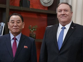 FILE - In this Jan. 18, 2019, file photo, U.S. Secretary of State Mike Pompeo, right, and Kim Yong Chol, a North Korean senior ruling party official and former intelligence chief, pose for photographs at the The Dupont Circle Hotel in Washington. The head of parliament's intelligence committee, Lee Hye-hoon, on Wednesday, April 24, 2019 cited South Korea's main spy agency as saying that Kim Yong Chol lost his Workers' Party post in charge of relations with South Korea.