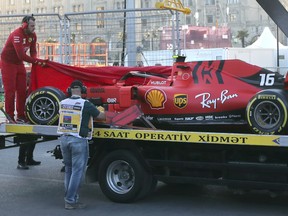 The car of Ferrari driver Charles Leclerc of Monaco is towed after he crashed during qualifying session at the Baku Formula One city circuit in Baku, Azerbaijan, Saturday, April 27, 2019. The Azerbaijan F1 Grand Prix race will be held on Sunday.