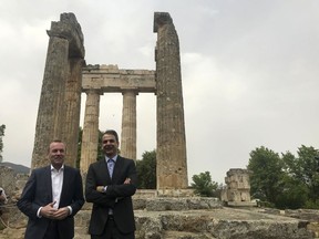 European People's Party candidate Manfred Weber, left, and the leader of Greece's conservative New Democracy party Kyriakos Mitsotakis visit an ancient temple at Nemea about 117 kilometers (73 miles) west of Athens on Tuesday, April 23, 2019. Weber is in Greece for the official launch of his campaign for the May 23-26 European Parliament elections.
