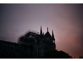 The Notre Dame cathedral is seen on sunrise after the fire in Paris, Tuesday, April 16, 2019. A catastrophic fire engulfed the upper reaches of Paris' soaring Notre Dame Cathedral as it was undergoing renovations Monday, threatening one of the greatest architectural treasures of the Western world as tourists and Parisians looked on aghast from the streets below.