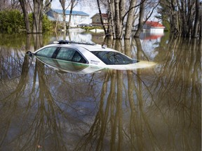 A submerged police car is seen in Ste-Marthe-sur-le-Lac, Quebec April 30, 2019 on Tuesday.