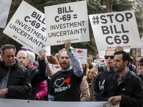 Pro-pipeline supporters rally outside a public hearing of the Senate Committee on Energy, the Environment and Natural Resources regarding Bill C-69 in Calgary, Alta., Tuesday, April 9, 2019.