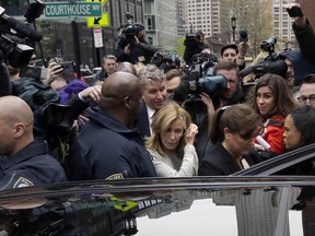 Felicity Huffman gets into a vehicle followed by her brother Moore Huffman Jr., outside federal court, Monday, May 13, 2019, in Boston, where she pleaded guilty to charges in a nationwide college admissions bribery scandal.