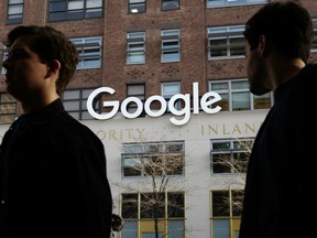 On Dec. 4, 2017 people walk by Google offices in New York.