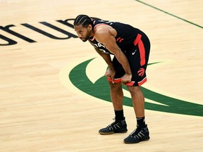 Kawhi Leonard of the Toronto Raptors looks on in the fourth quarter against the Milwaukee Bucks in Game One of the Eastern Conference Finals of the 2019 NBA Playoffs at the Fiserv Forum on May 15, 2019 in Milwaukee, Wisconsin.
