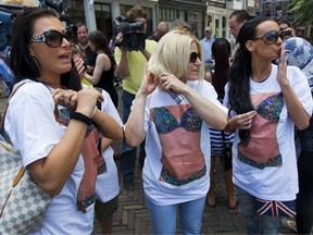 Prostitutes demonstrate in front of the city hall  in Utrecht on July 25, 2013, after the closure of their prostitution boats at the Utrecht Zandpad after it was linked to human trafficking.