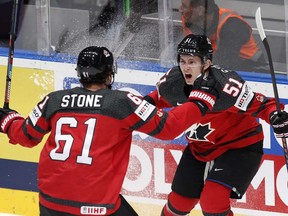 Canada's Mark Stone celebrates with Troy Stecher, right, after scoring his side's first goal during the Ice Hockey World Championships semifinal match between Canada and Czech Republic in Bratislava, Slovakia, Saturday, May 25, 2019.