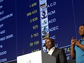 Mosotho Moepya, a Commissioner of the Independent Electoral Commission (IEC), speaks at the podium at the results center in Pretoria, South Africa Thursday, May 9, 2019. South Africans voted Wednesday in a national election and preliminary results show that the ruling African National Congress party (ANC) has an early lead in the national elections but has seen its share of the vote drop significantly.
