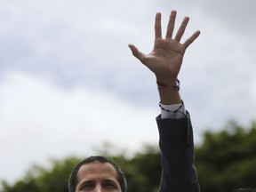 Opposition leader Juan Guaidó greets supporters as he arrives to lead a rally in Caracas, Venezuela, Saturday, May 11, 2019. Guaidó has called for nationwide marches protesting the Maduro government, demanding new elections and the release of jailed opposition lawmakers.