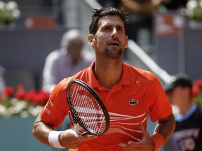Novak Djokovic, of Serbia, celebrates winning at the end of his match against Jeremy Barty, of France, during the Madrid Open tennis tournament, in Madrid, Spain, Thursday, May 9, 2019.