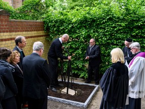 A box containing the remains of political prisoners executed by the Nazis and dissected for research, is lowered into a grave during a funeral ceremony at Berlin's Dorotheenstadt cemetery on May 13, 2019.