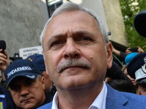 This file photo taken on April 15, 2019 shows Romania's Social Democrat Party leader Liviu Dragnea  leaving the High court of Cassation and Justice (ICCJ) after his last appearance before the court in the "fake jobs" case.