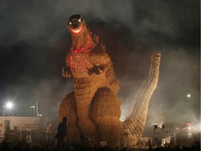 This November 5, 2016 picture shows a 7-meter-tall and 10-metre-long straw-made Godzilla being displayed at an autumn festival in Chikuzen, Fukuoka prefecture.