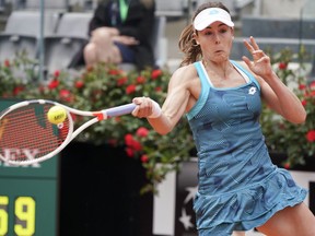 Alize Cornet, of France, returns the ball to Aryna Sabalenka, of Belarus, at the Italian Open tennis tournament, in Rome, Tuesday, May, 14, 2019. Cornet won 6-1, 6-4.