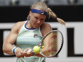 Kiki Bertens of the Netherlands returns the ball to Johanna Konta of Britain during a semifinal match at the Italian Open tennis tournament, in Rome, Saturday, May 18, 2019.