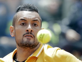 Nick Kyrgios of Australia returns the ball to Daniil Medvedev of Russia at the Italian Open tennis tournament, in Rome, Tuesday, May, 14, 2019. Kyrgios won 6-3, 3-6, 6-3.