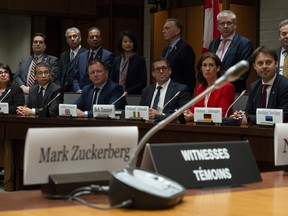 Standing Committee on Access to Information, Privacy and Ethics Chair Bob Zimmer and members of the International Grand Committee on Big Data, Privacy and Democracy listen to a question from media during a news conference in Ottawa, Tuesday, May 28, 2019.