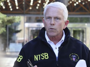 Clint Johnson, head of the National Transportation Safety Board's Alaska region, addresses reporters Tuesday, May 21, 2019, outside the federal building in Anchorage, Alaska. Johnson said he anticipates the preliminary report into the May 20, 2019, floatplane crash in Metlakatla, Alaska, that killed the pilot and passenger to be released by the end of the week.