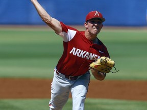 Arkansas pitcher Connor Nolan throws during the first inning of the Southeastern Conference tournament NCAA college baseball game against Mississippi, Friday, May 24, 2019, in Hoover, Ala.