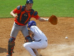 LSU's Giovanni DiGiacom (7) slides safely into home to tie the game on a wild pitch as Auburn catcher Matt Scheffler (6) looks for the ball during the ninth inning of the Southeastern Conference tournament NCAA college baseball game, Thursday, May 23, 2019, in Hoover, Ala.