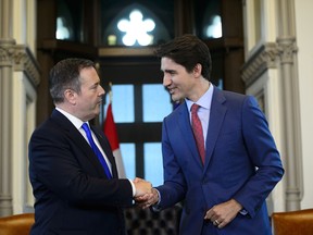 Prime Minister Justin Trudeau shakes hands with Alberta Premier Jason Kenney. Alberta is called on to provide other provinces with massive wealth transfers, even as other provinces have worked to hurt Alberta’s economy.
