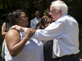 Presidential candidate Sen. Bernie Sanders hugs Pamela Rush after visiting her home in Tyler, Ala., on Monday, May 20, 2019.