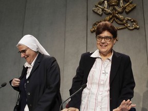 Sister Carmen Sammut, right, leader of the International Union of Superiors General, and Donatella Zoia, Superior General of the Sisters of the Most Precious Blood, arrive for a press conference at the Vatican, Thursday, May 2, 2019. Sammut says religious sisters are increasingly speaking out about sexual and other forms of abuse by clergy and says their superiors must be better trained to understand the problem and respond.