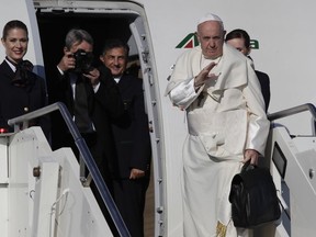 Pope Francis waves as he boards the airplane for Bucarest, Romania at Rome's Fiumicino International airport, Friday, May 31, 2019. Pope Francis is heading to Romania for a three-day, cross-country pilgrimage that in many ways is completing the 1999 trip by St. John Paul II that marked the first-ever papal visit to a majority Orthodox country.