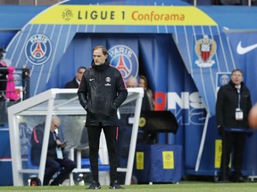 FILE - In this Saturday, May 4, 2019 file photo, PSG coach Thomas Tuchel watches his team during the French League One soccer match between Paris Saint-Germain and Nice at the Parc des Princes stadium in Paris, France. Tuchel has extended his contract for another year until June 2021 despite the club doing less than well than in previous seasons.