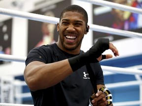 British boxer Anthony Joshua laughs, prior to a media session at the English institute of Sport, in Sheffield, England, Wednesday May 1, 2019. Andy Ruiz Jr. will look to become Mexico's first heavyweight champion after replacing Jarrell Miller as the opponent for unbeaten WBA, IBF and WBO titleholder Anthony Joshua.