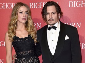 In this Jan. 2, 2016, file photo, Amber Heard, left, and Johnny Depp arrive at the 27th annual Palm Springs International Film Festival Awards Gala in Palm Springs, Calif. In a complaint filed Friday, March 1, 2019, Depp is suing his ex-wife Heard in a $50 million defamation lawsuit, citing a piece she wrote for The Washington Post about domestic abuse.