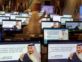 Screensavers showing King Salman are visible on computers at the press center for upcoming summits, in Mecca, Saudi Arabia, Thursday, May 30, 2019. Salman convenes Arab heads of state from the Gulf and Arab League to discuss escalation in tension with Iran. Arabic on computers reads, "Despite all the challenges facing our Arab nation. We are optimistic about a promising future that fulfills the hopes of our nations for leadership."