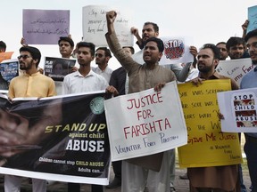 Members of a civil society group, Volunteer Force Pakistan, hold a demonstration to condemn the rape and killing of a girl, in Islamabad, Pakistan, Wednesday, May 22, 2019. Authorities in Pakistan suspended a police chief in the capital, Islamabad, over the disappearance, rape and killing of a 10-year-old girl whose case triggered widespread condemnation and outrage, including on social media. Officer Mohammad Imran says the chief, Mohammad Abbas, was suspended on Wednesday for failing to act promptly in the case.