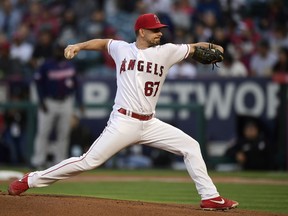 CORRECTS TO STARTING PITCHER NOT RELIEF PITCHER - Los Angeles Angels starting pitcher Taylor Cole throws to the plate during the first inning of a baseball game against the Minnesota Twins, Monday, May 20, 2019, in Anaheim, Calif.