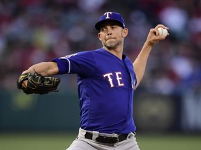 Texas Rangers starting pitcher Mike Minor throws during the first inning of the team's baseball game against the Los Angeles Angels on Saturday, May 25, 2019, in Anaheim, Calif.