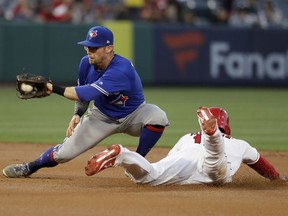 Los Angeles Angels' Brian Goodwin, right, steals second past Toronto Blue Jays second baseman Eric Sogard during the first inning of a baseball game in Anaheim, Calif., Thursday, May 2, 2019.