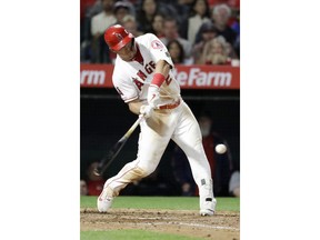 Los Angeles Angels' Mike Trout hits a three-run double against the Toronto Blue Jays during the fourth inning of a baseball game in Anaheim, Calif., Wednesday, May 1, 2019.