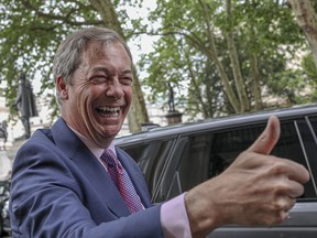 Brexit Party leader Nigel Farage arrives at the party's HQ prior to an event to mark the gains his party made in the European Elections, in London, Monday, May 27, 2019.